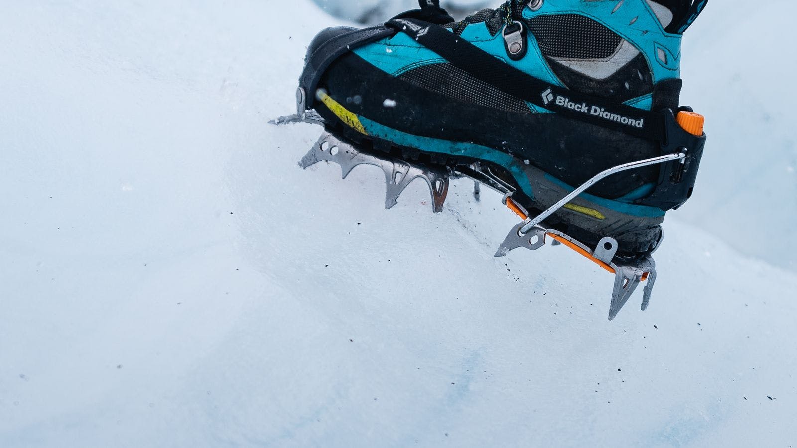 crampons on blue boots on glacier hiking tour in Iceland